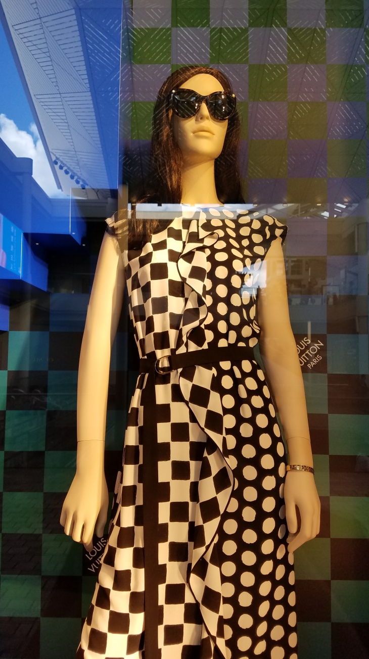A mannequin in the window of Louis Vuitton at Ala Moana.